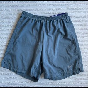 Mens grey nike shorts with purple liner. Size medium